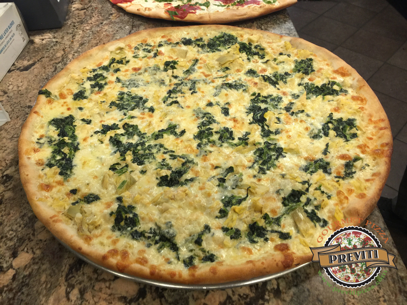 18" round eight slice pie. Artichoke and spinach with a truffle cream sauce.